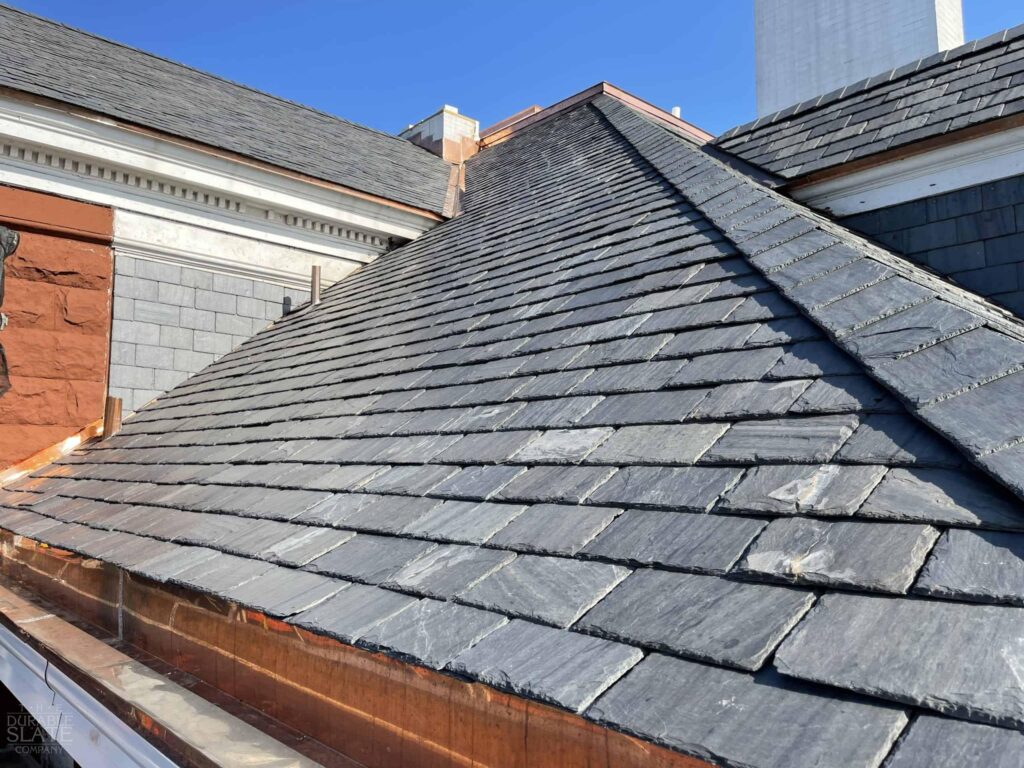The roof of a building with a slate roof repaired and installed by paragon roofing BC, one of the best roofers in Vancouver.