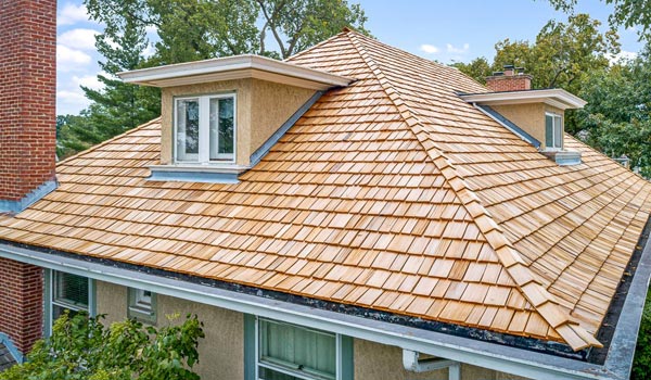 A house with a shingled roof requiring the expertise of roofers in Vancouver.
